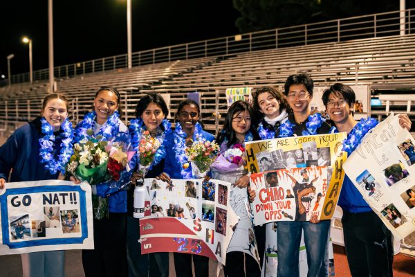 Seniors pose on Senior night following their Logan meet.