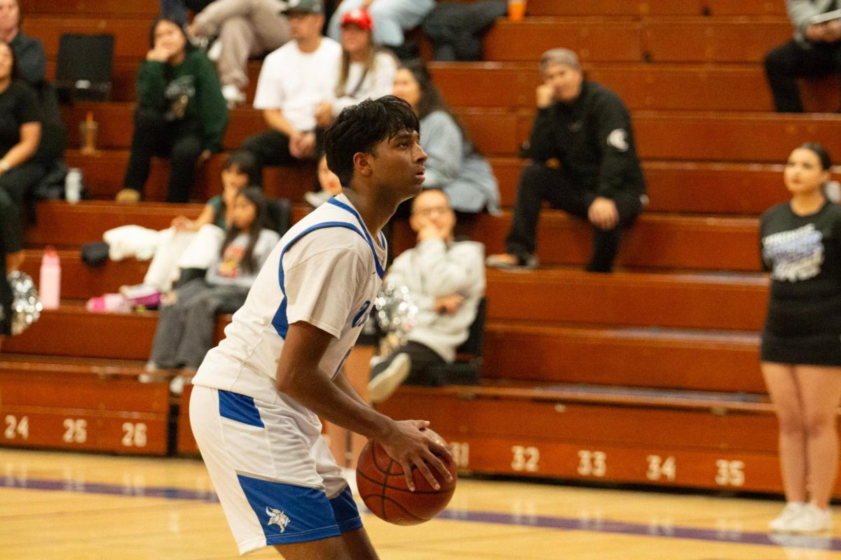 Point guard and co-captain Aneesh Malyala (12) prepares to shoot a freethrow.