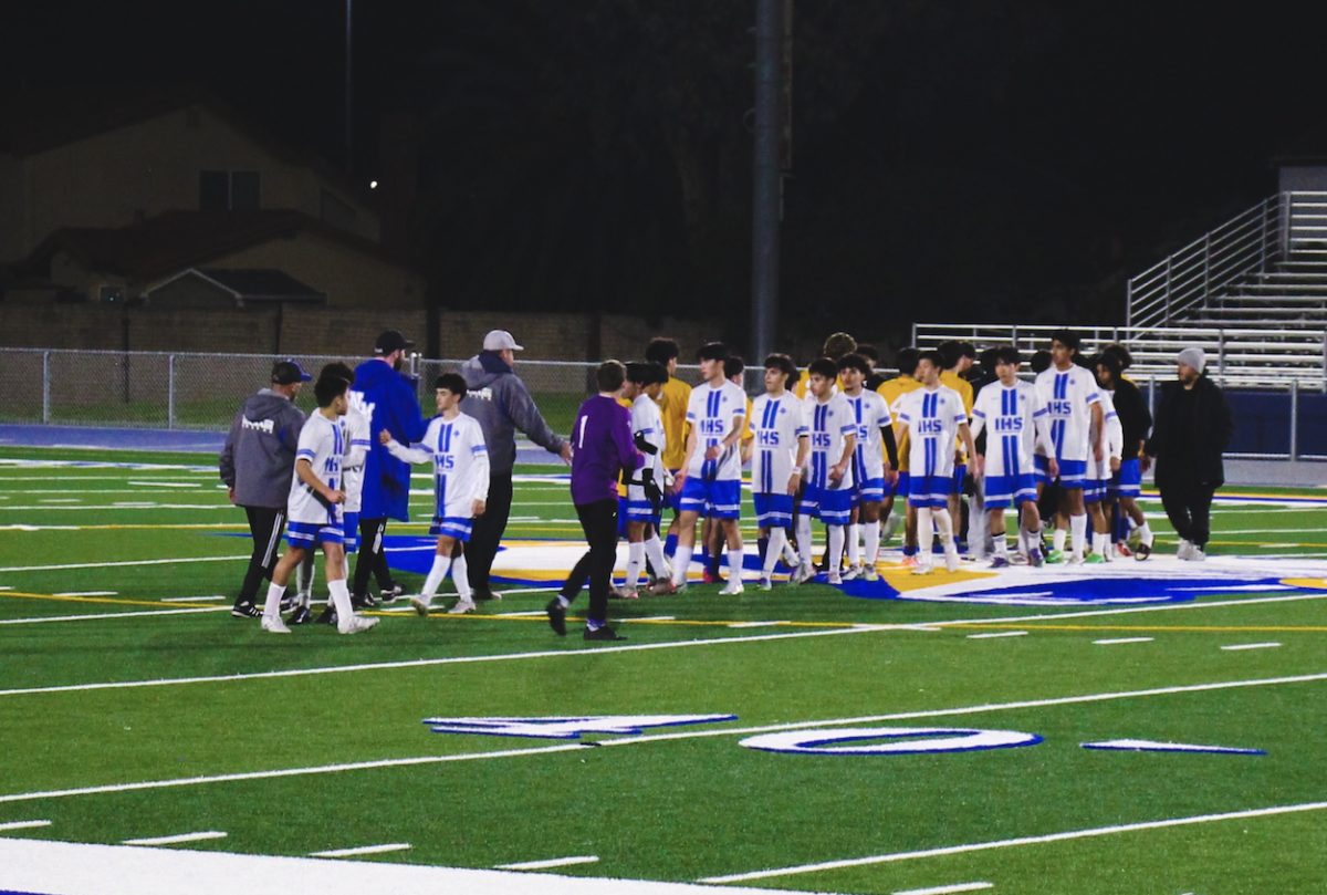 Irvington and Newark Memorial Shake Hands at the end of a well fought game.
