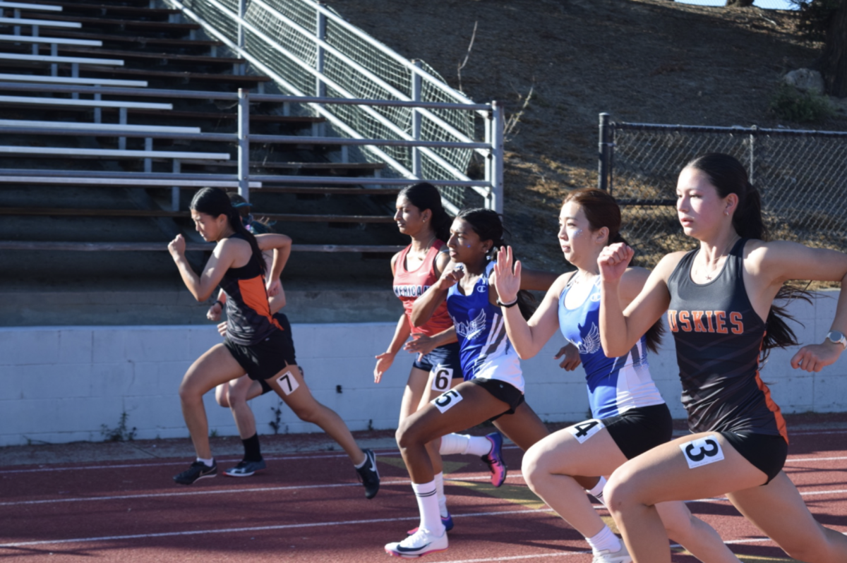 Runners from each of the FUSD schools are seen sprinting during their 4x100 meter relays.
