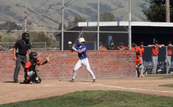 Wesley Ren (12) steps up to the base ready to hit