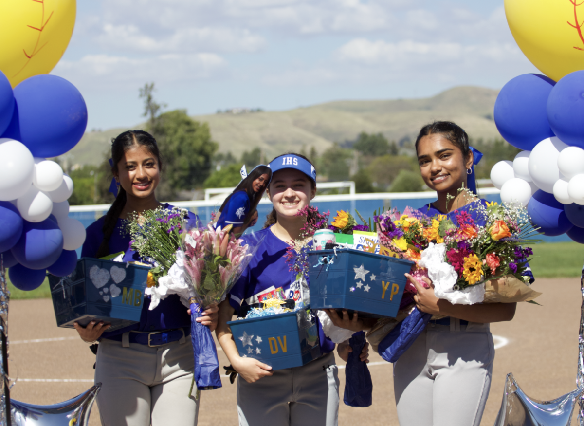 Seniors Meher Bhullar, Diya Vacin, and Yaamini Putti pose following their senior night.
