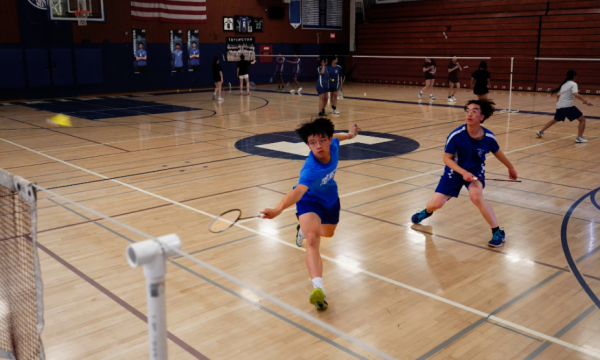 Jayden Huang (12) and Zackary Tsui (11) face off Logan High School players in their final game of the season.