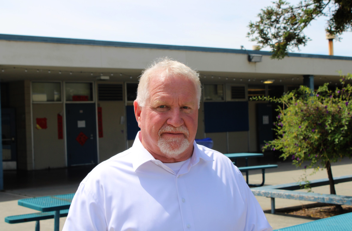 Mr. Hicks taking a break from administrative work in the courtyard.